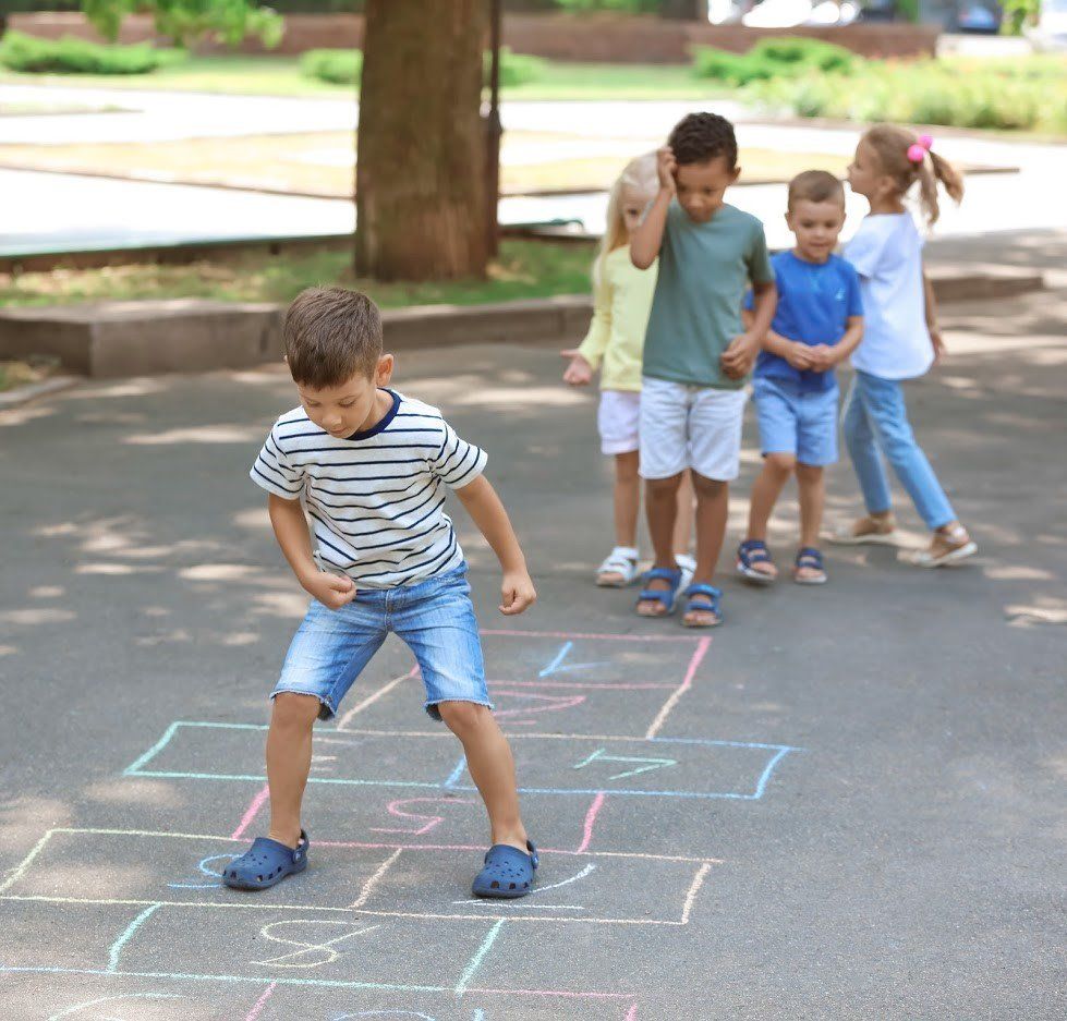 Children playing in driveway - 3 Garage Door Child-Safety Tips | Edgemont Garage Door Service