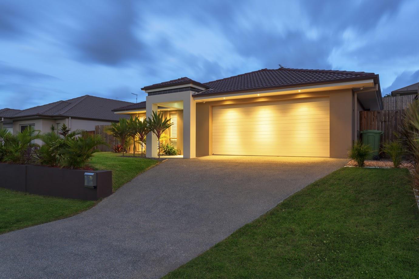 Modern House With Lights On — Signal Hill, CA — Edgemont Garage Door Service Modern House With Lights On — Signal Hill, CA — Edgemont Garage Door Service