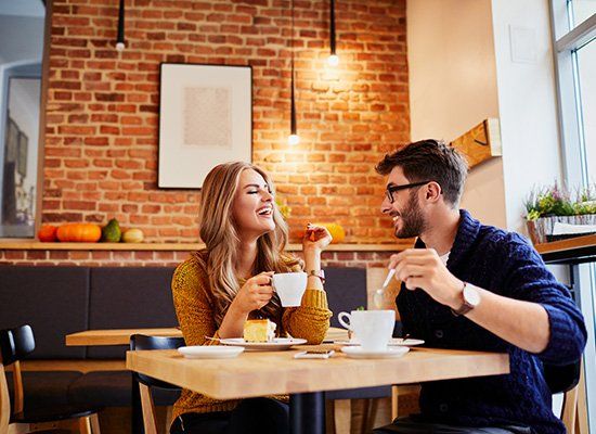 Couple Of Young People Drinking Coffee — Newtown, PA — Piccolo Trattoria Italian Catering