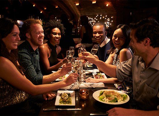 Group Of Friends Enjoying Meal — Newtown, PA — Piccolo Trattoria Italian Catering