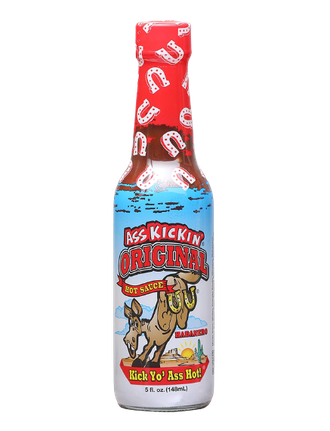 A bottle of Ass Kickin' Original Hot Sauce with a donkey graphic and a red cap against a white background.
