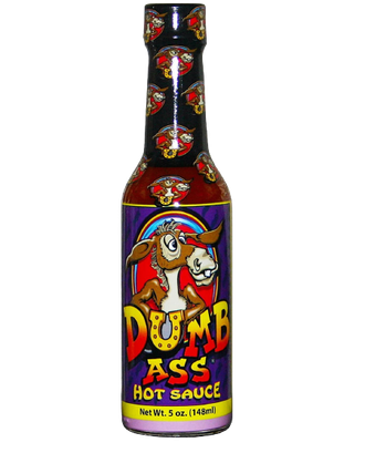 A bottle of Dumb Ass hot sauce, featuring a cartoon donkey illustration on a purple label with a red and yellow logo.