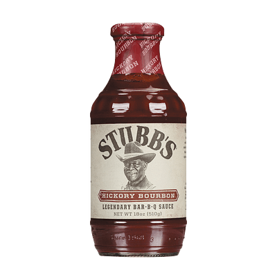 A bottle of Stubb's Hickory Bourbon Legendary Bar-B-Q Sauce with a cream label and red seal.