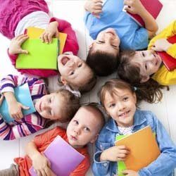 Children Smiling and Doing Homework at Daycare | Goffstown, NH | Educare Daycare & Learning Center Children Smiling and Doing Homework at Daycare | Goffstown, NH | Educare Daycare & Learning Center