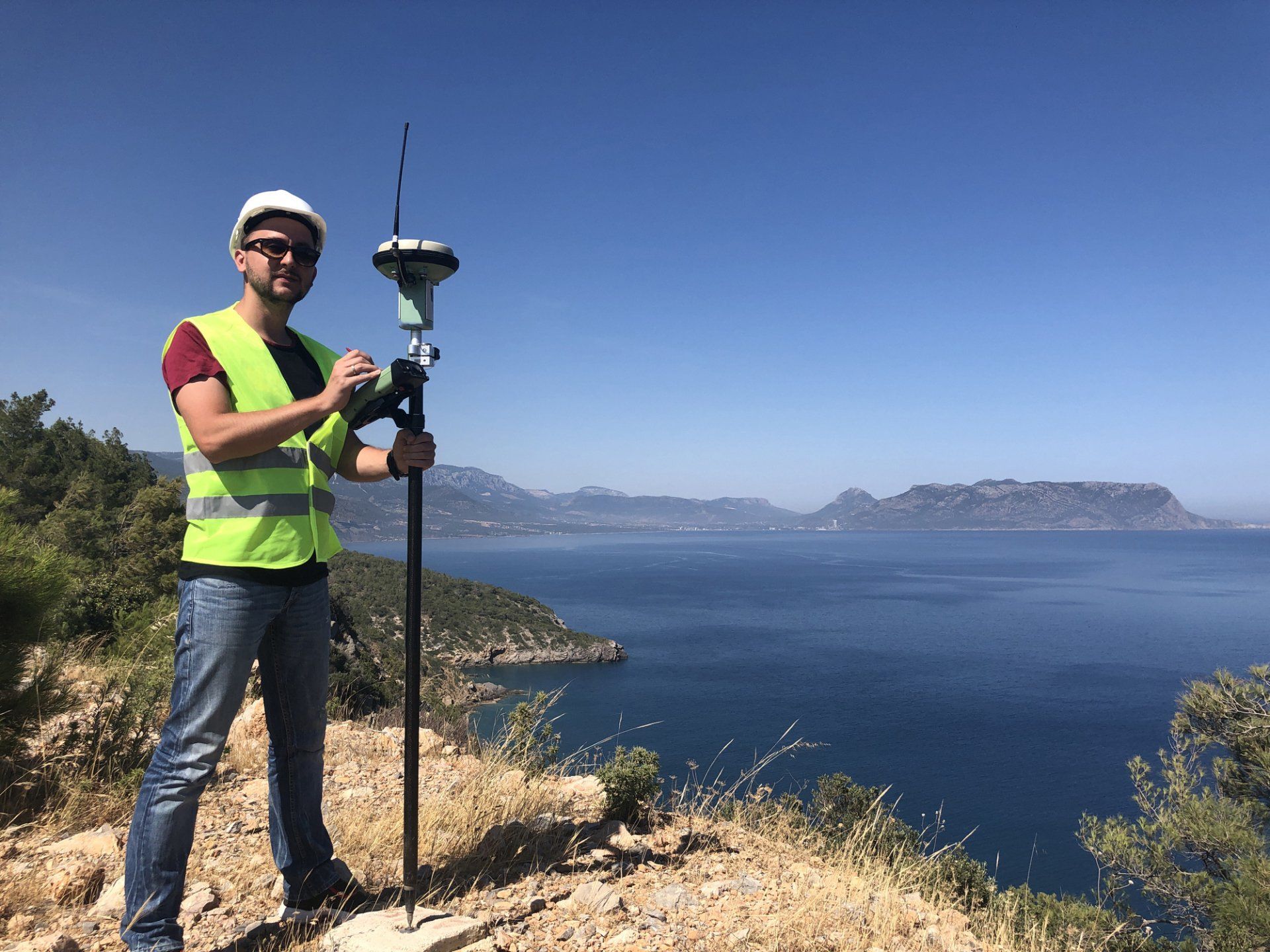 Commercial — A Worker Using A Theodolite In Myrtle Beach, SC Commercial — A Worker Using A Theodolite In Myrtle Beach, SC