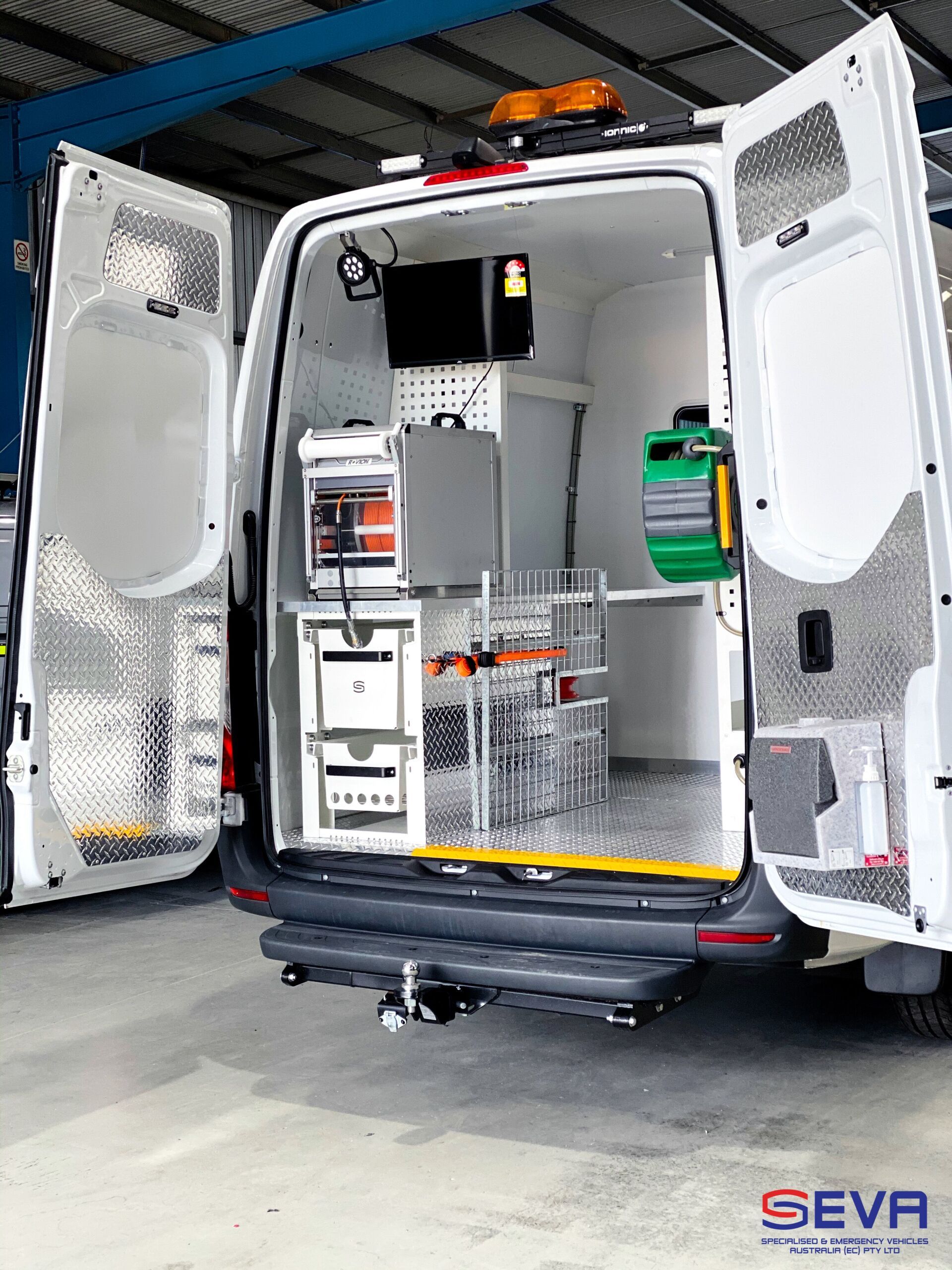 A White Van with The Doors Open Is Parked in A Garage — Cable & Pipe Locations in Woolgoolga, NSW