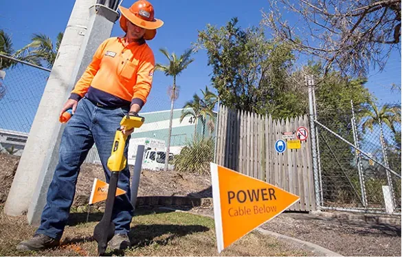Man Holding A Radio Detector — Cable & Pipe Locations in Woolgoolga, NSW