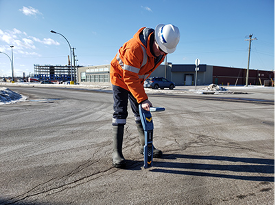Construction Worker Detecting Electronic Cables Underground — Cable & Pipe Locations in Woolgoolga, NSW