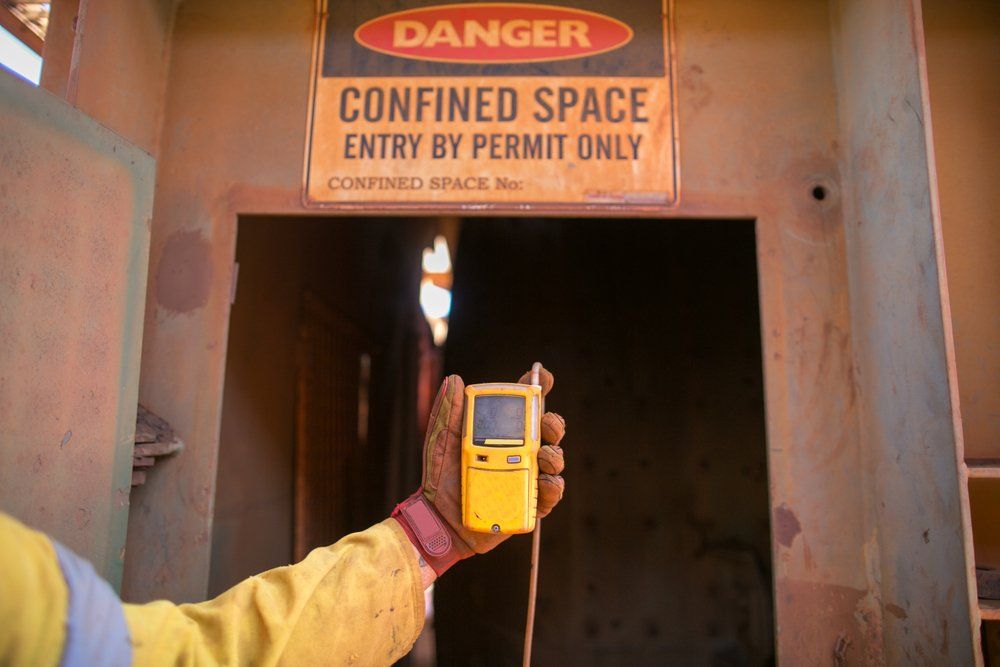 Constructor worker holding gas test leak detector — Cable & Pipe Locations in Woolgoolga, NSW