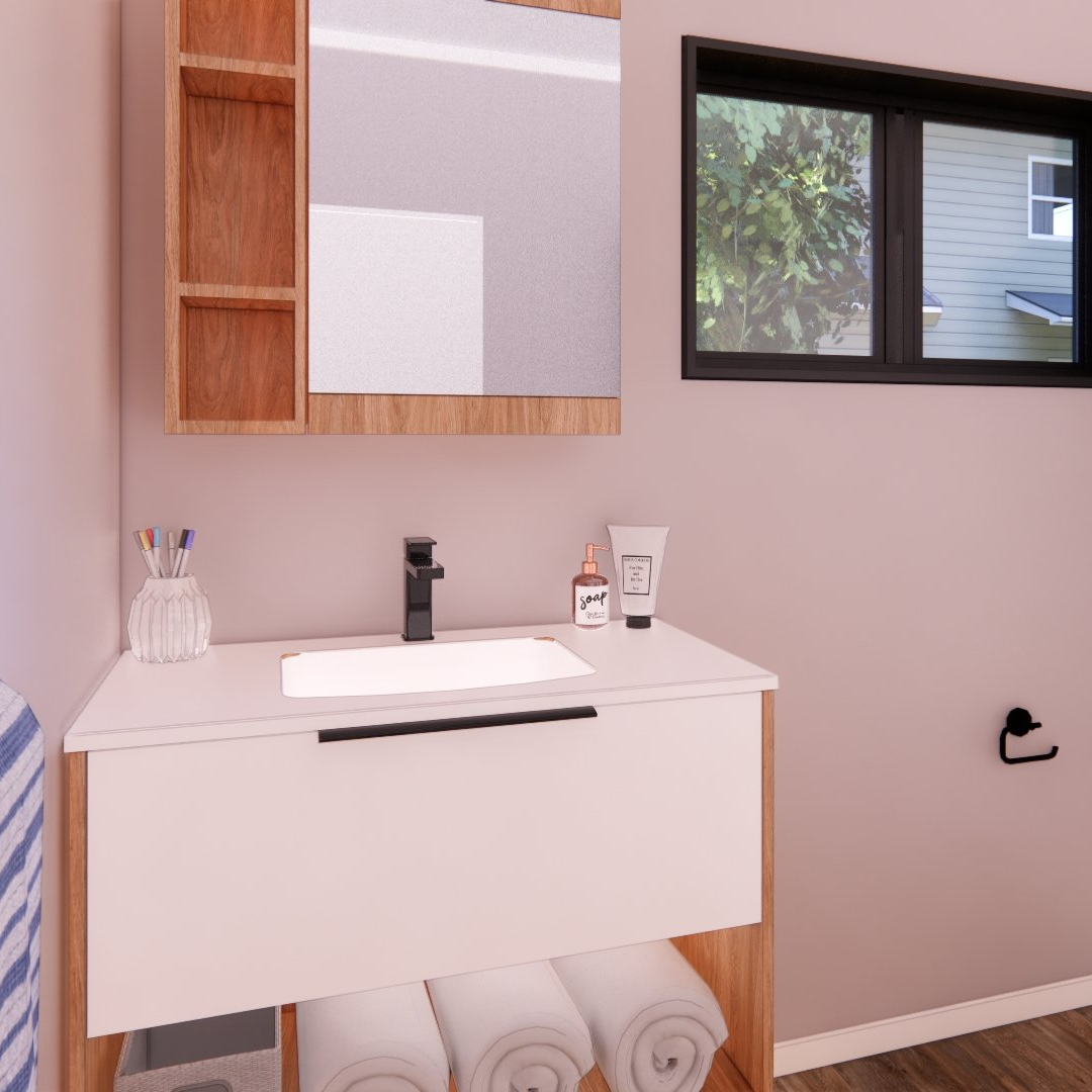 A bathroom with a sink , mirror and window