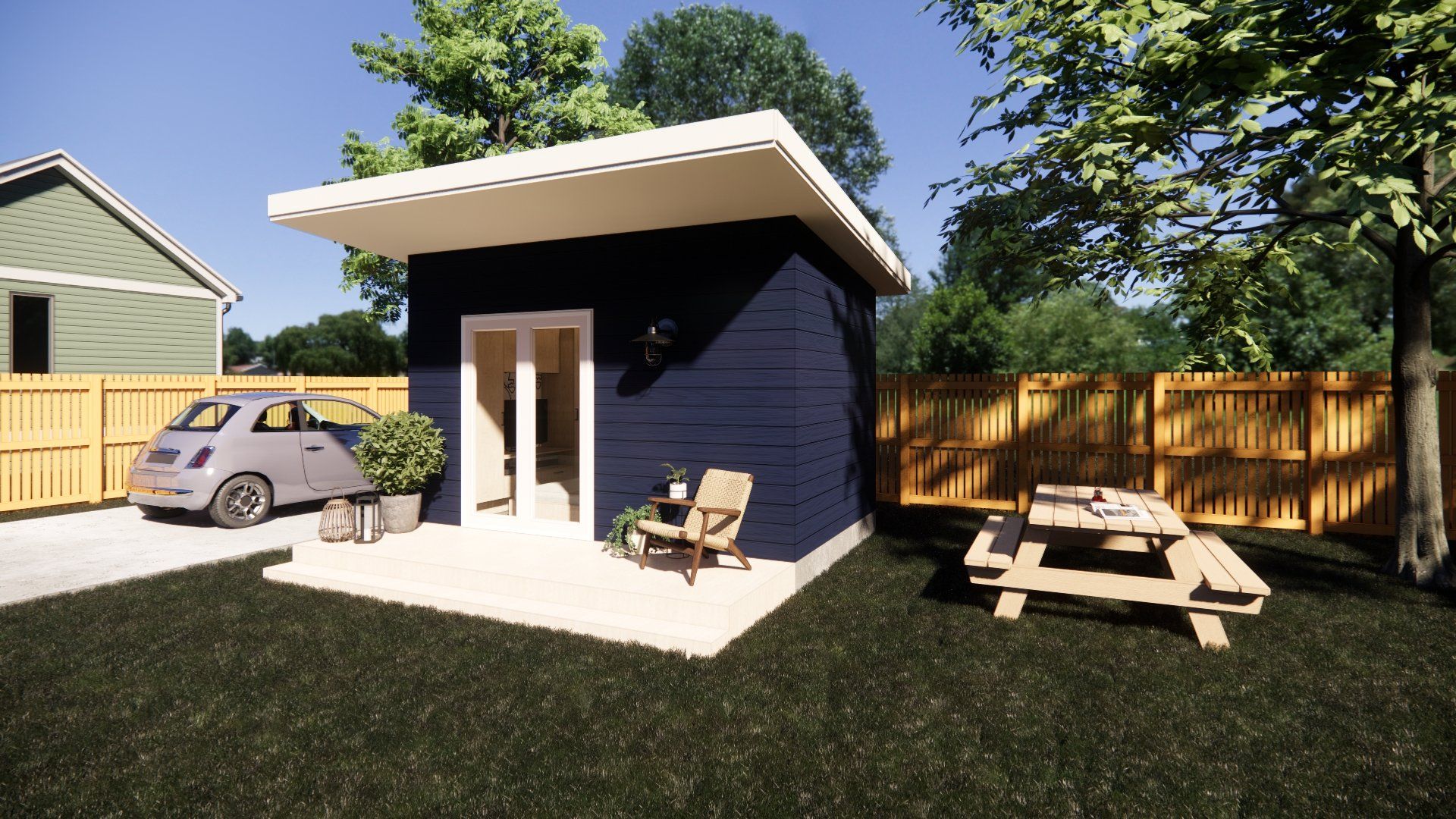 A small house with a car parked in front of it and a picnic table in the backyard.