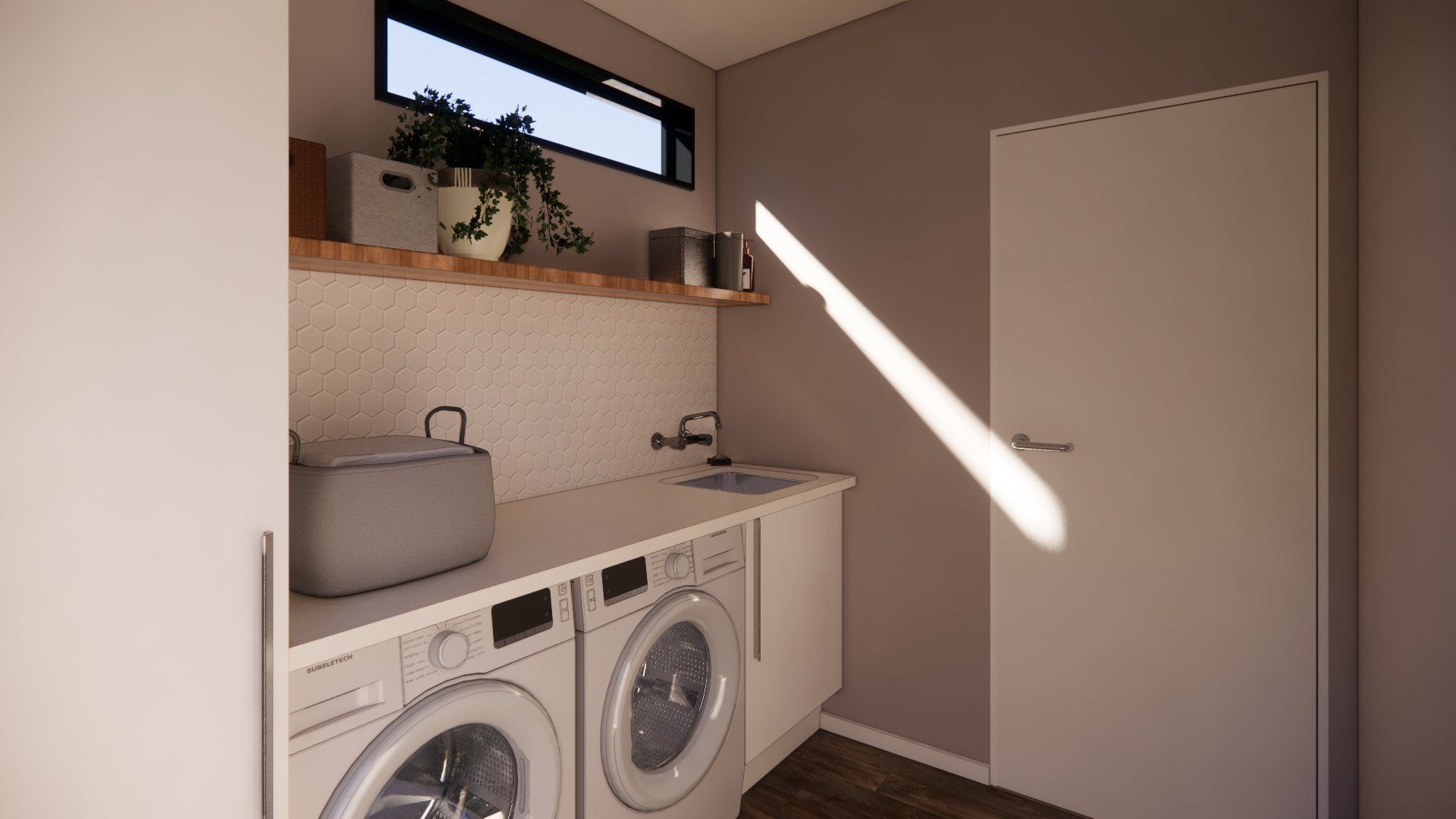 A laundry room with a washer and dryer and a sink.
