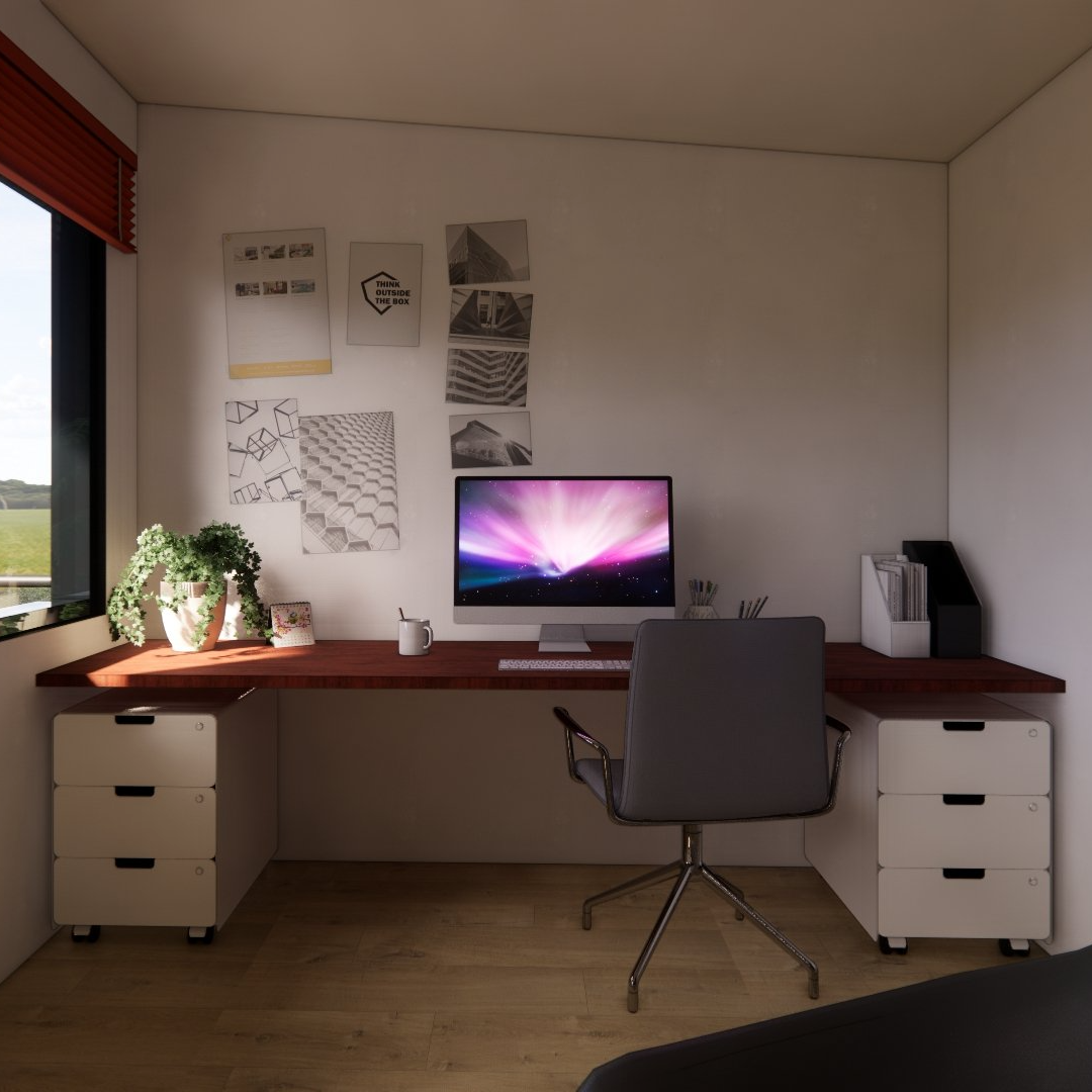 A desk with a computer on it and a chair