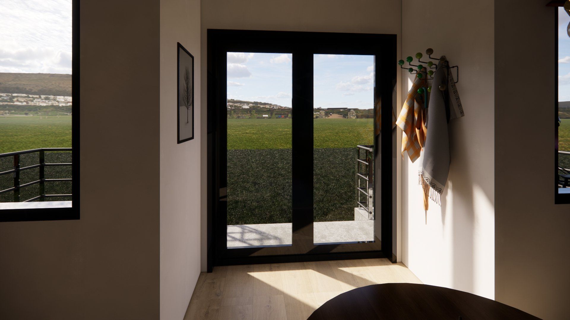 A living room with sliding glass doors and a view of a field.