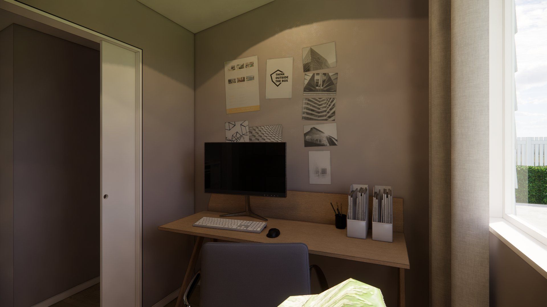 There is a computer on the desk in the room.