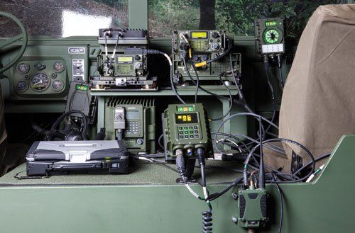 A military vehicle has a lot of wires connected to it