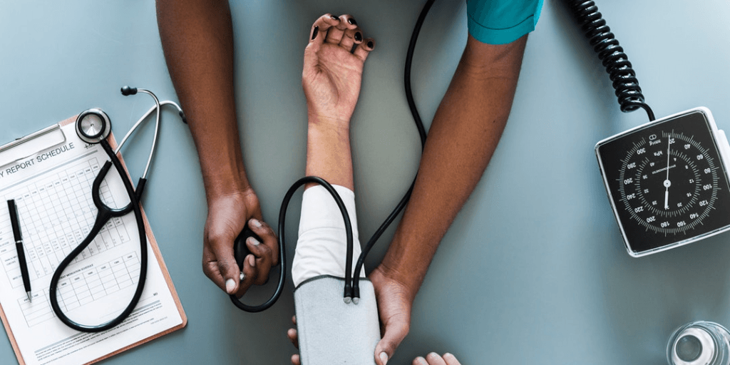 checking blood pressure at doctor
