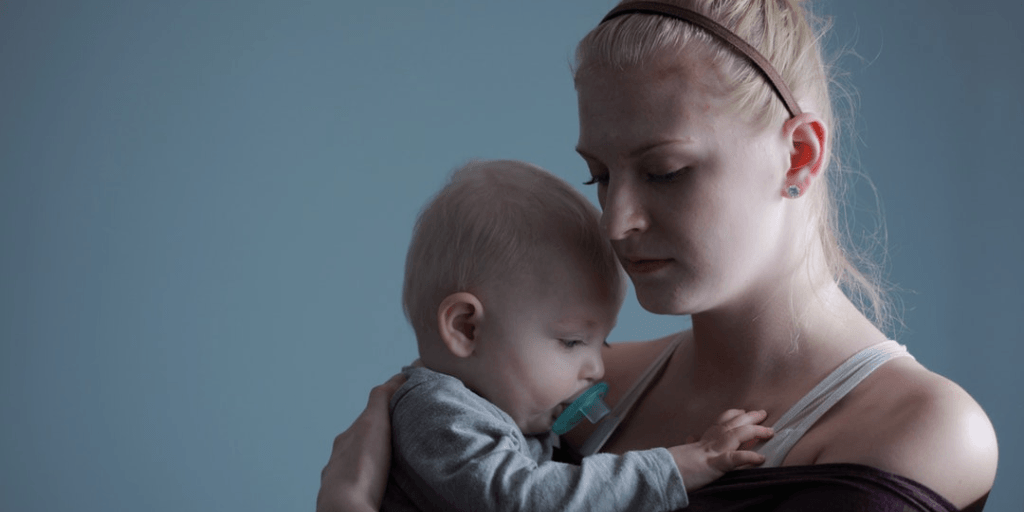 woman holding baby