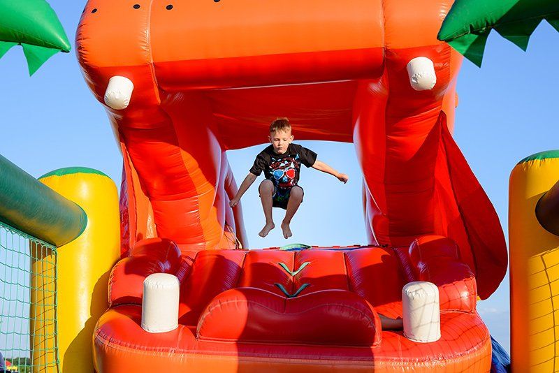 Young boy jumping in a castle