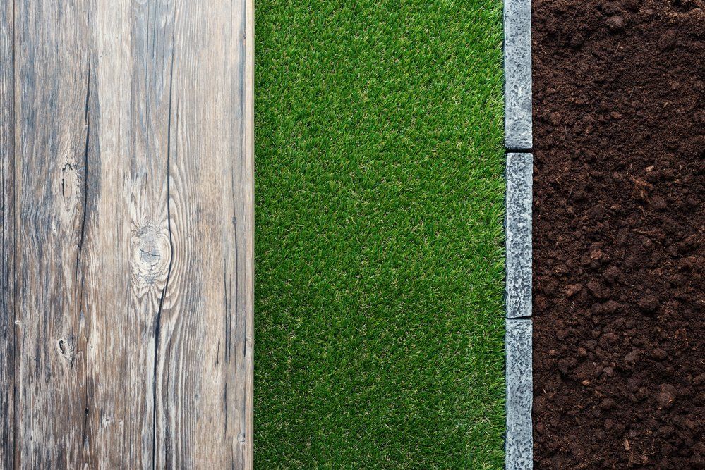 Different types of lawn edging materials side by side