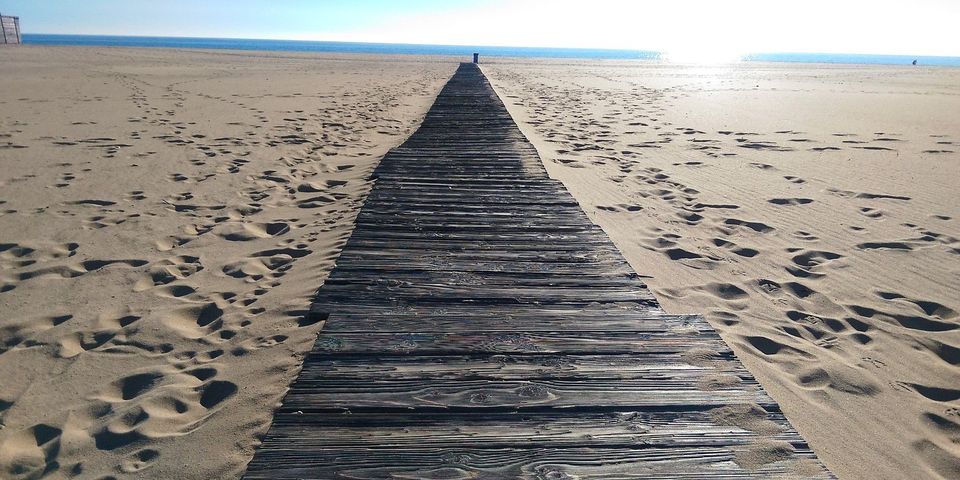 a seashore with a walkway