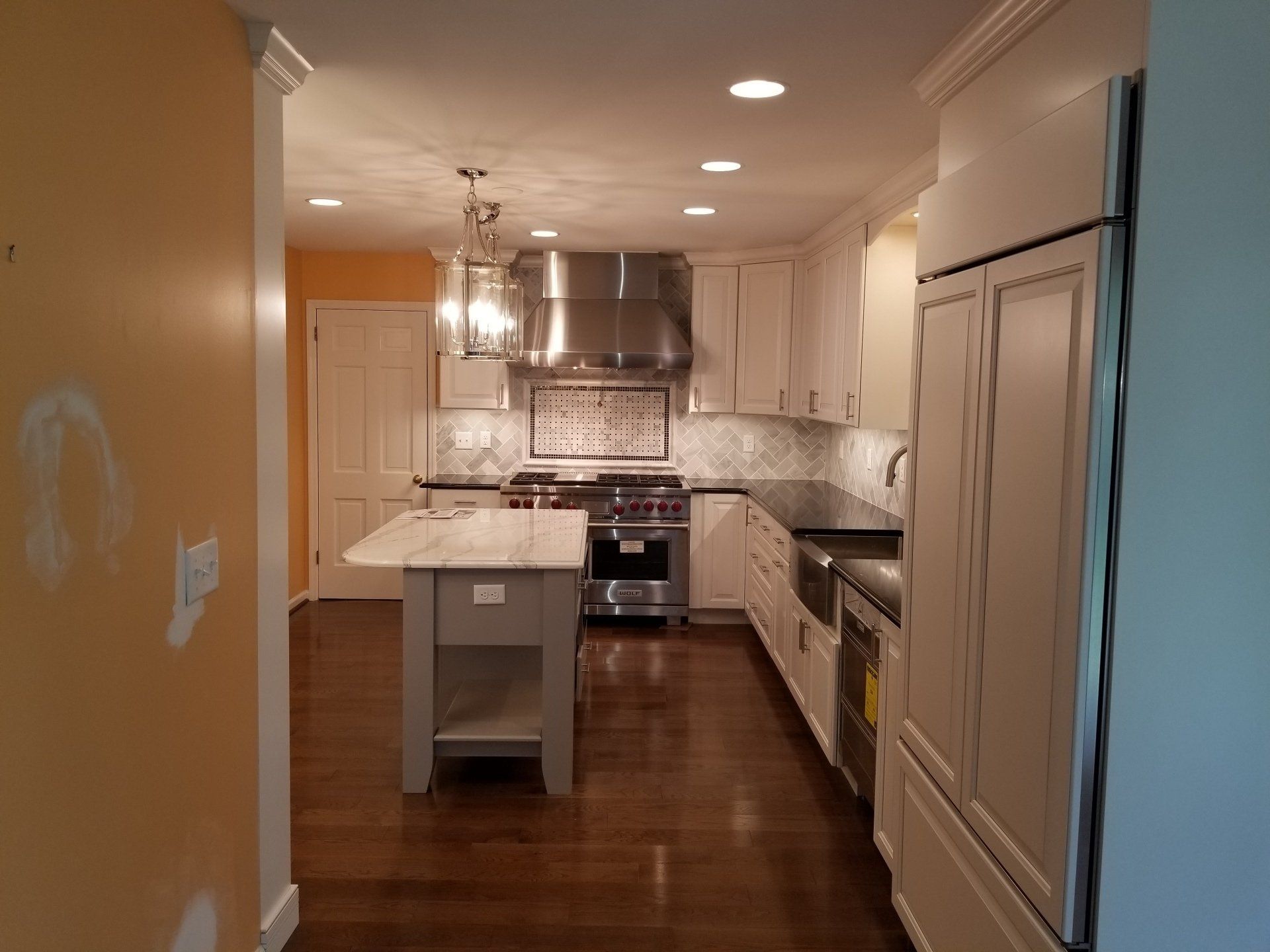 Laminate — Small White Kitchen with Cabinets in Wilmington, DE