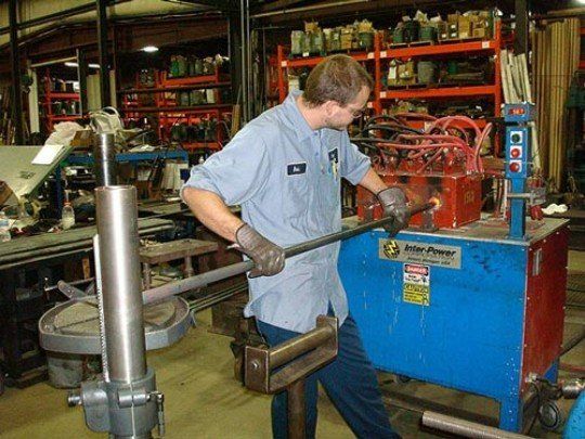 Our Worker holding A Metal on Hot Forge, Hot Forging Services in Crown Point, IN