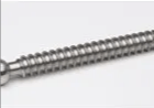 A close up of a stainless steel screw on a white surface.