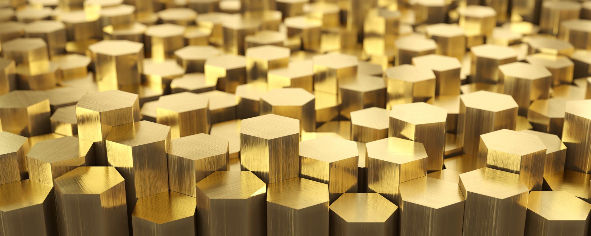A bunch of gold hexagons are stacked on top of each other.