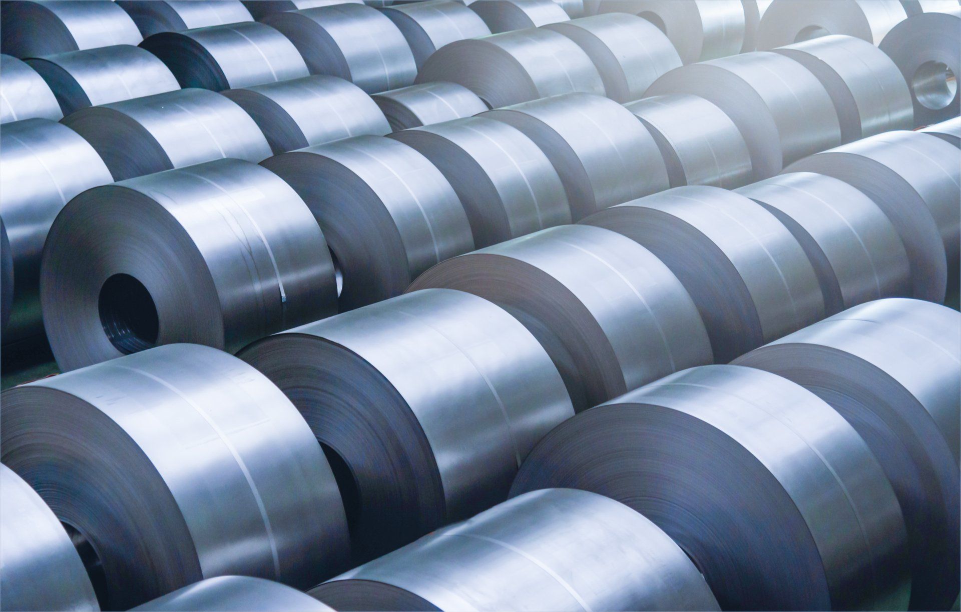 A bunch of metal rolls stacked on top of each other