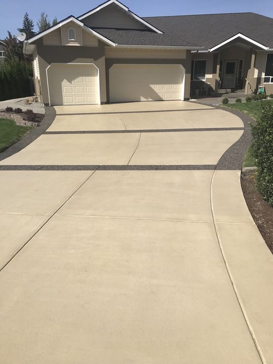 Concrete Floors — Man Working On Flooring In Post Falls, ID