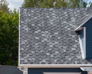 Roofing Maintenance — Roofer Laying Tile On The Roof In Albuquerque, NM Roofing Maintenance — Roofer Laying Tile On The Roof In Albuquerque, NM