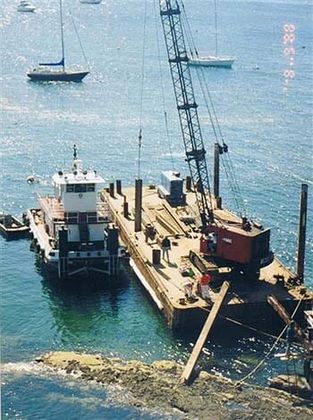 Pile Driving Machine on Construction Site - Pier Construction in Salem, MA Pile Driving Machine on Construction Site - Pier Construction in Salem, MA