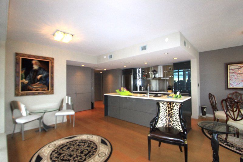 view of kitchen in a L'hermitage 2 bedroom and den condo rental in Vancouver, Canada presented by Rebecca Punch.