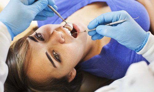 dentist checking the teeth
