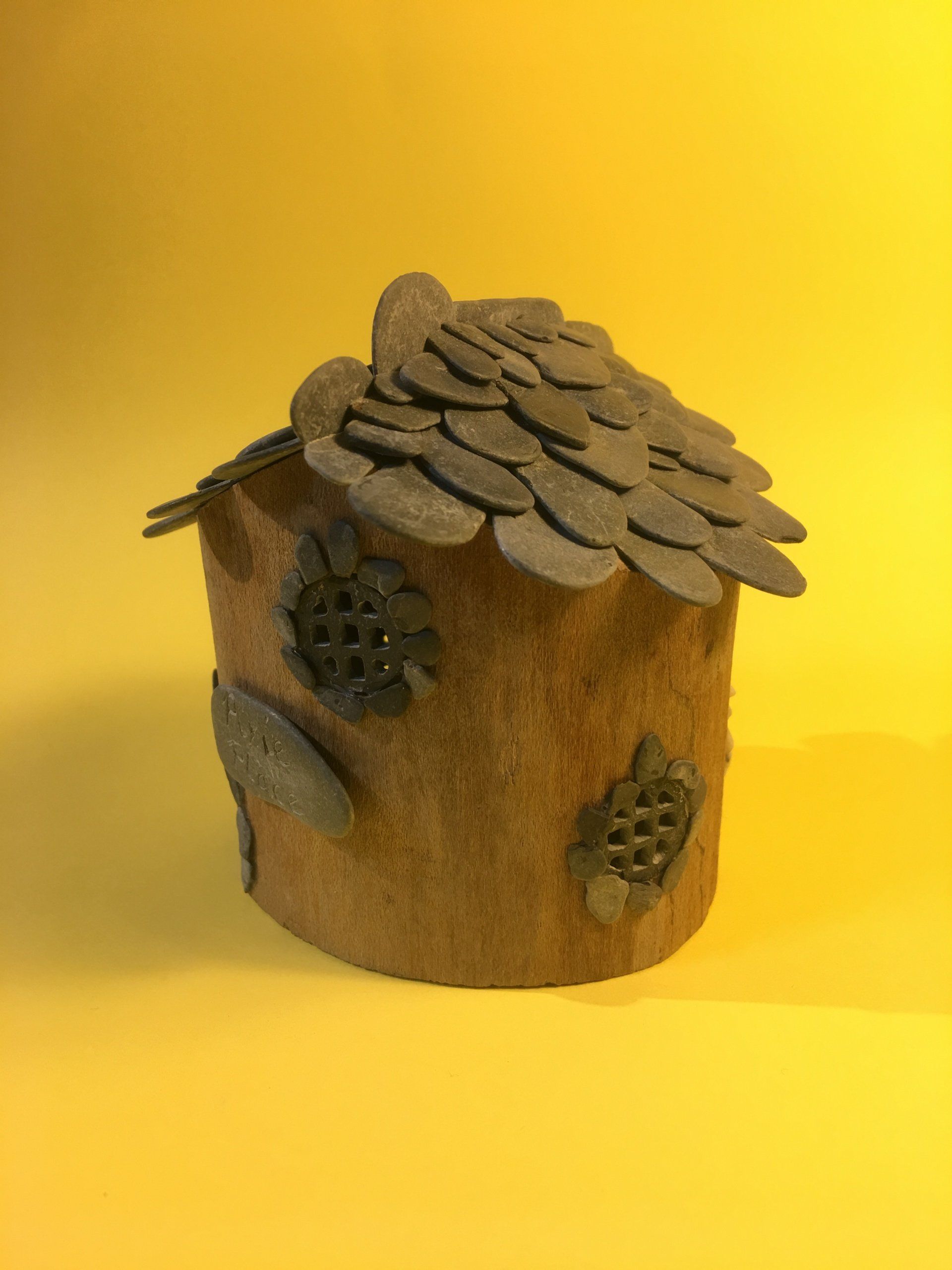 Small fairy house hollowed out drift wood and Devonian mudstone roof and windows.