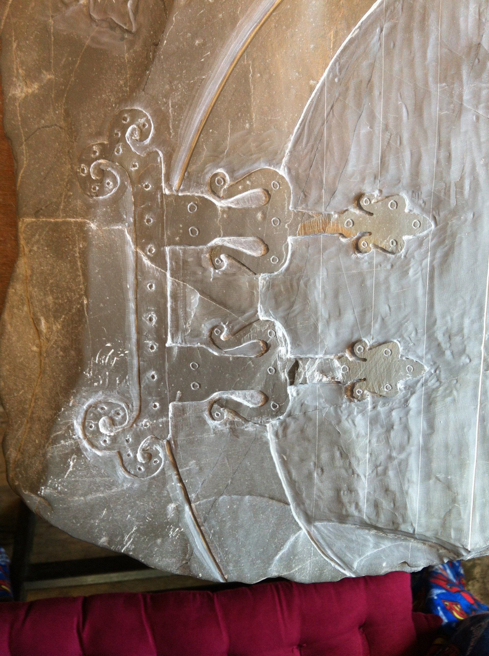 Hinge details from a large fairy door hand engraved using a Devonian mudstone beach stone.
