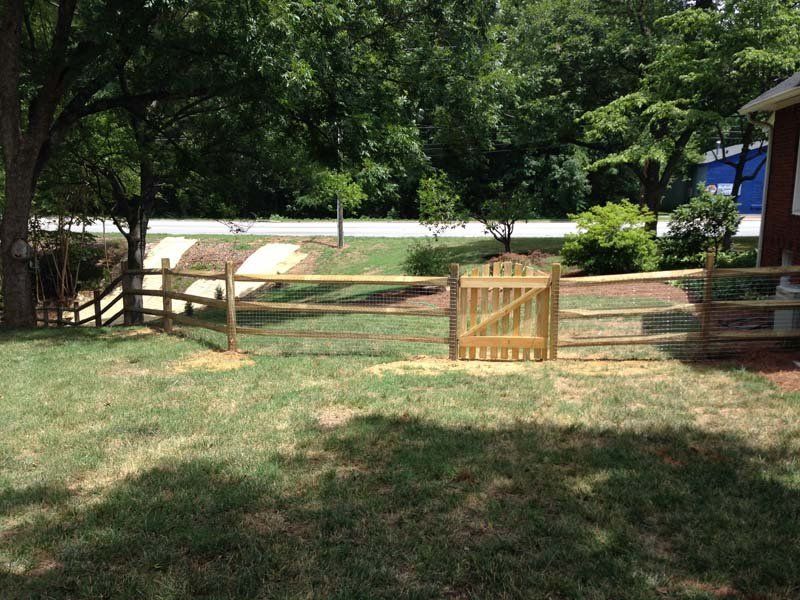 Three Rail Fence Covered in Chicken Wire with a Gate