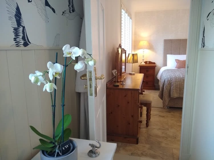 Open door leading into large bedroom