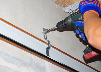Garage Door Installation — Worker Installing Garage Door Opener in Glendale Heights, IL
