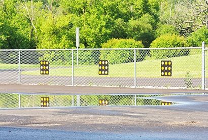 Chain Link Fence Repair — Chain-link Fence On Commercial Place In Independence, MO Chain Link Fence Repair — Chain-link Fence On Commercial Place In Independence, MO