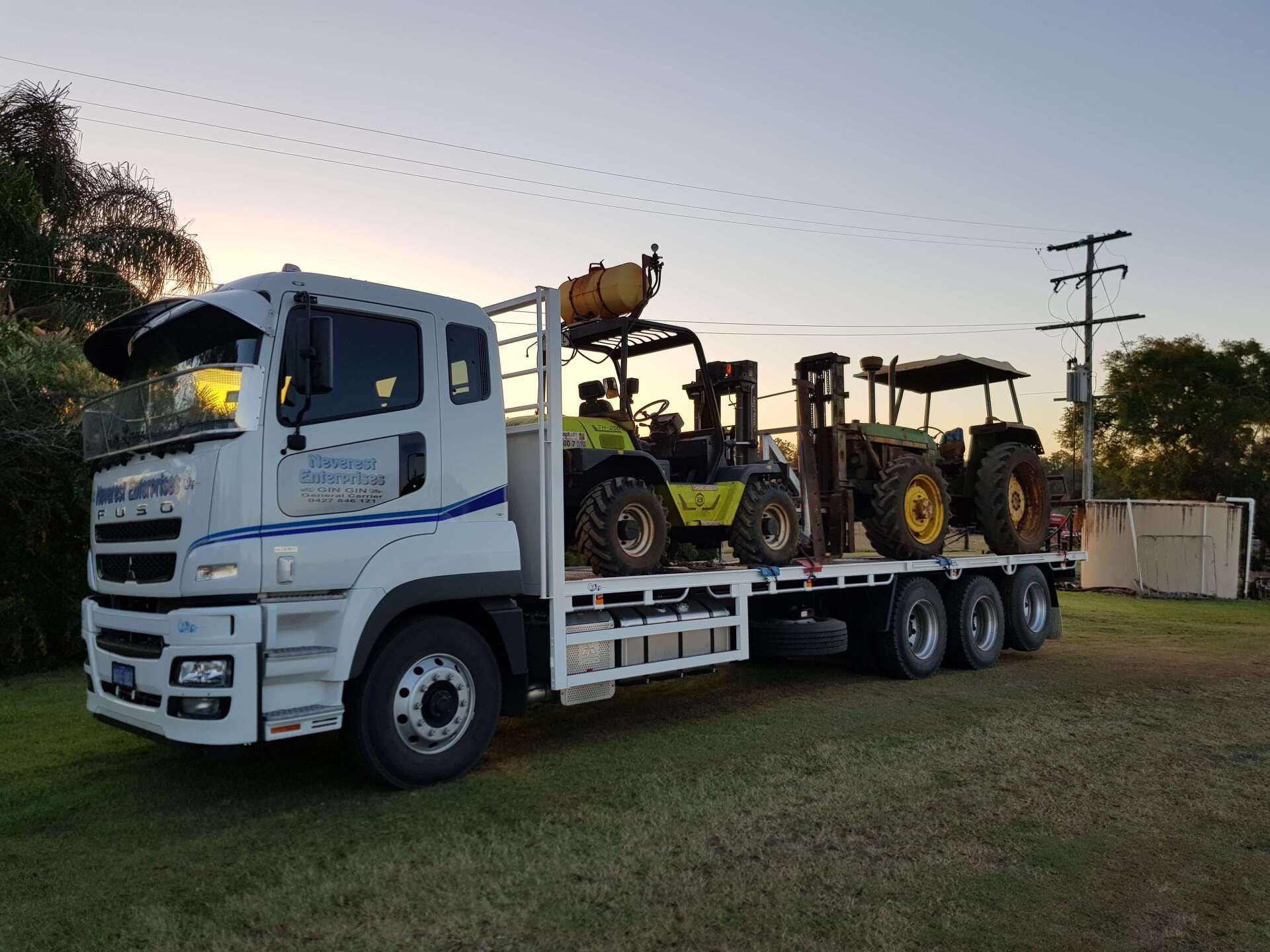Truck Carrying Two Tractors β Deliveries in Gin Gin, QLD