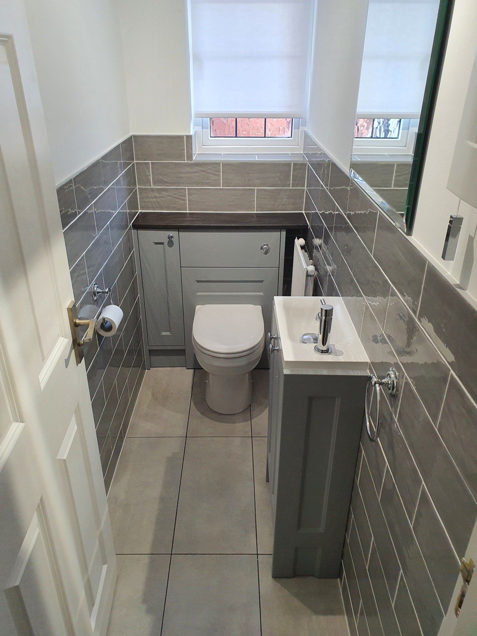 A simple outdate cloakroom refurbished into a modern grey cloakroom with added storage. We will be returning to do the en-suite soon.