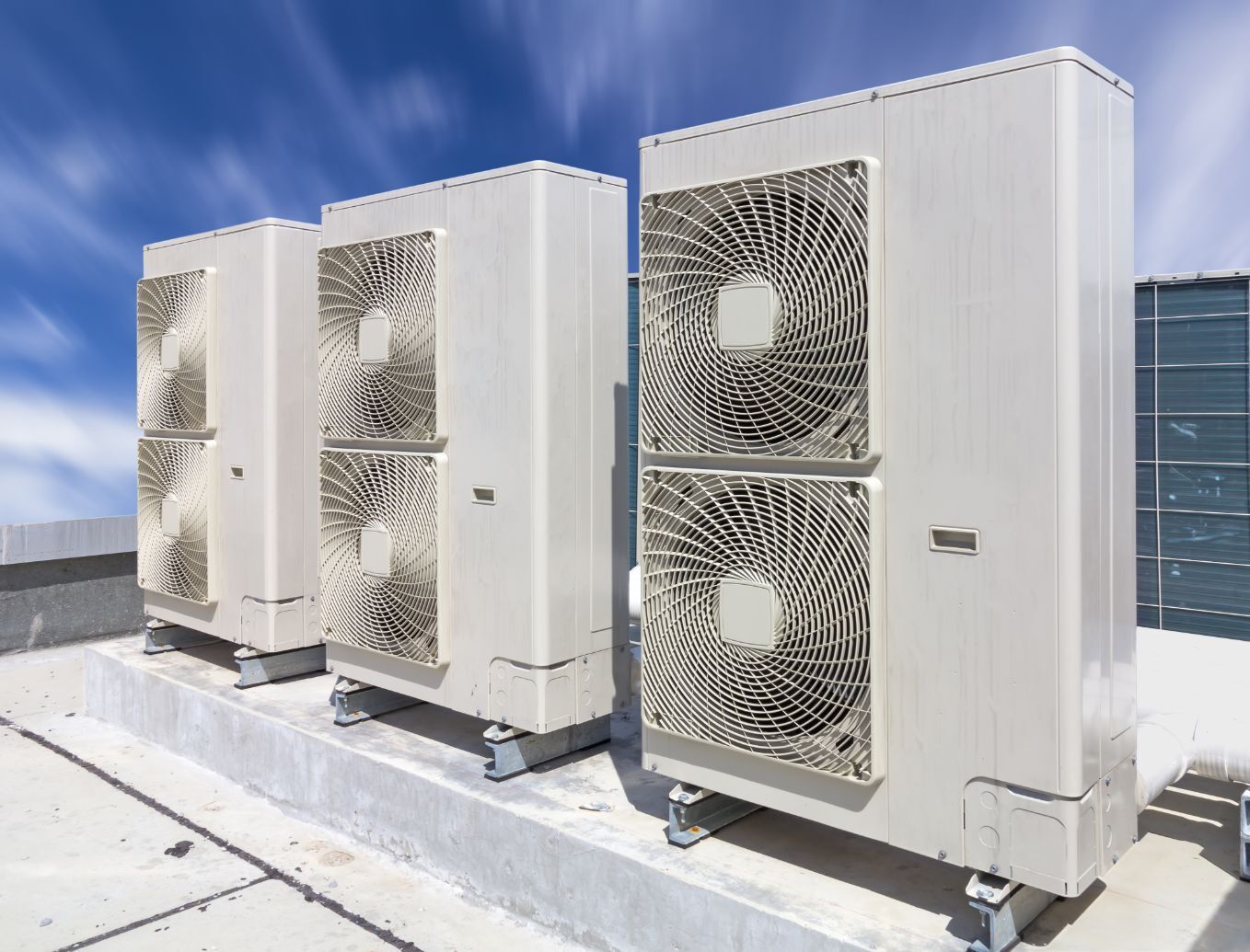 Clean & Healthy Air — Air Conditioner Cleaning In Cairns, QLD Three Air Conditioners Are Sitting on Top of a Roof— Air-Con Cleaning Specialists in Redlynch, QLD