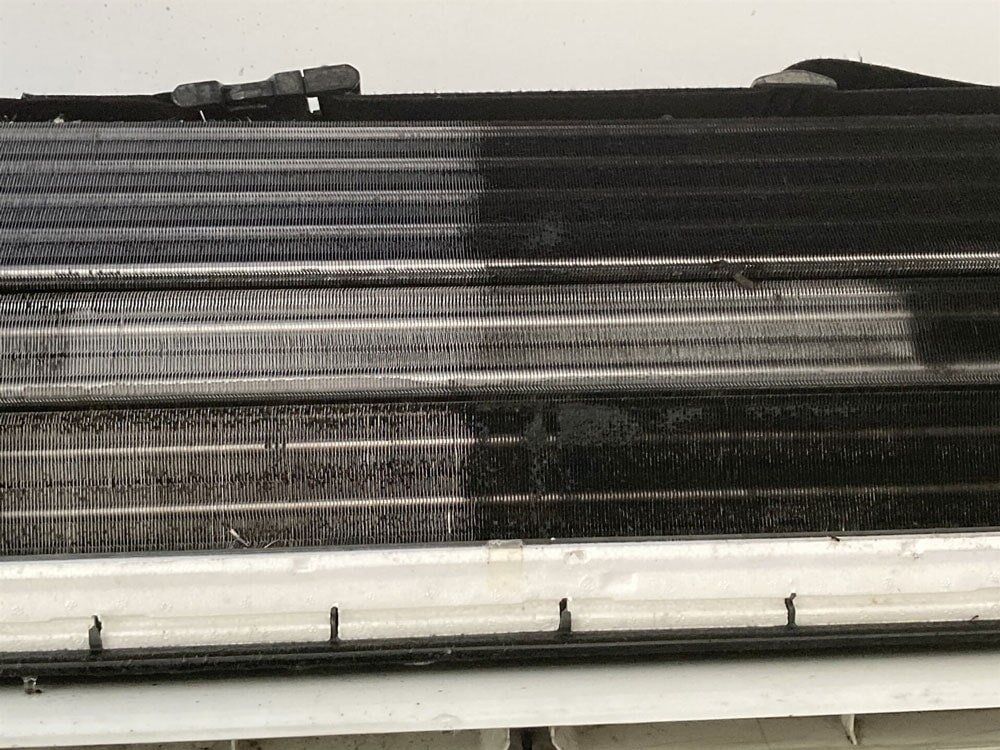 Air filter — Air Conditioner Cleaning In Cairns, QLD A Black and White Photo of a Dirty Air Conditioner — Air-Con Cleaning Specialists in Redlynch, QLD
