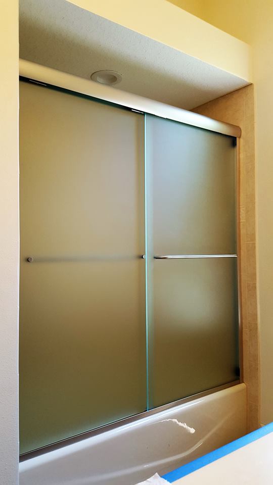 Glass Shelving — Bathroom Mirror With Brown Wall in Sarasota, FL One of our glass shower enclosures in Sarasota, FL