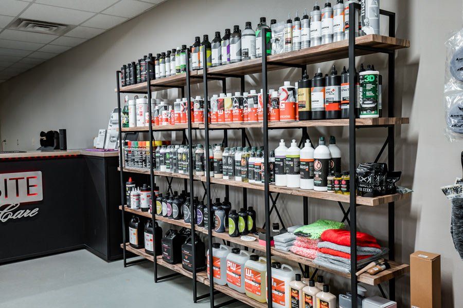 A store filled with shelves filled with lots of bottles of cleaning supplies.