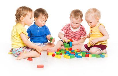 Childcare Solutions — Children Playing Toy Blocks in Leavenworth, KS Childcare Solutions — Children Playing Toy Blocks in Leavenworth, KS