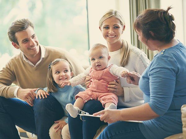 Family Smiling in Therapy - Family Counseling in Warrenton, VA Family Smiling in Therapy - Family Counseling in Warrenton, VA