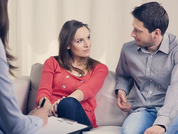 Couple Looking to each other in Therapy Session - Violence Counseling in Warrenton, VA Couple Looking to each other in Therapy Session - Violence Counseling in Warrenton, VA